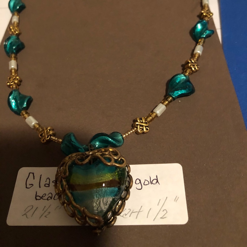 Glass bead necklace with caged heart.